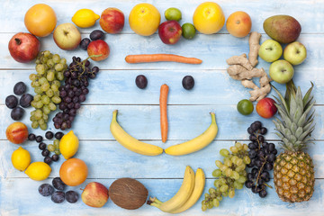 Fruits on a blue wooden board, top view