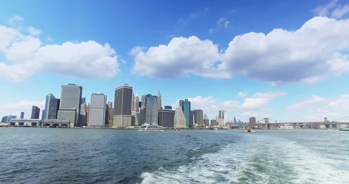 A daytime view of the lower Manhattan skyline as seen from the East River Ferry on the way to Governors Island.	 	