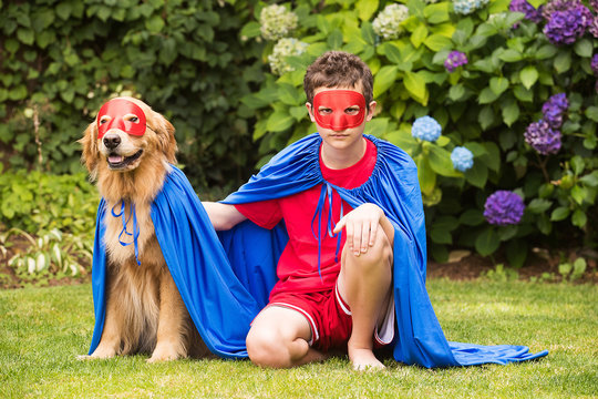 Super boy and super dog in cape and mask