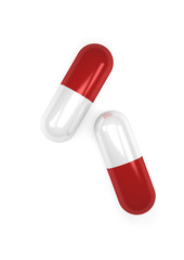 Red pills capsules isolated on white background