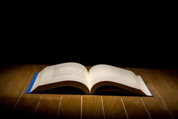 Open Book on wood background