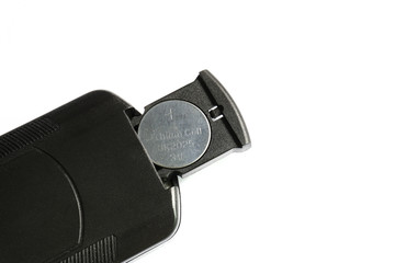 Battery replacement for remote control on white background