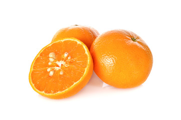whole and half cut orange on white background