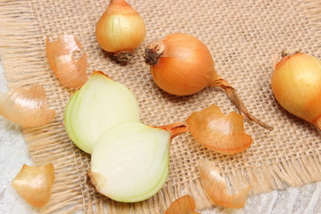 Fresh onions on jute canvas, healthy nutrition and strengthening immunity
