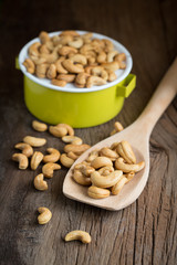 Cashew nuts on a wooden spoon