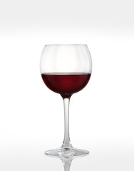 glass with red wine on a white background.
