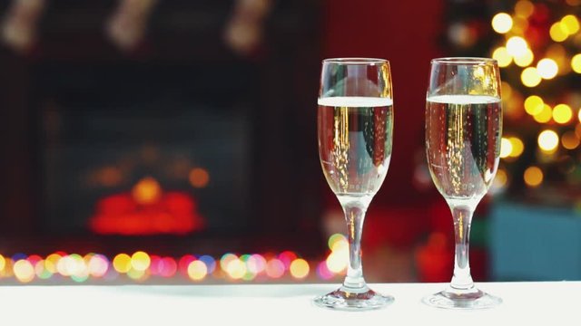 Room decorated for Christmas with two glasses of champagne