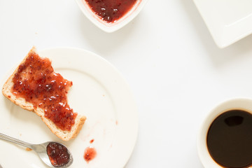 Bitten bread with strawberry jam