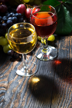 assortment different wine on dark wooden table, vertical