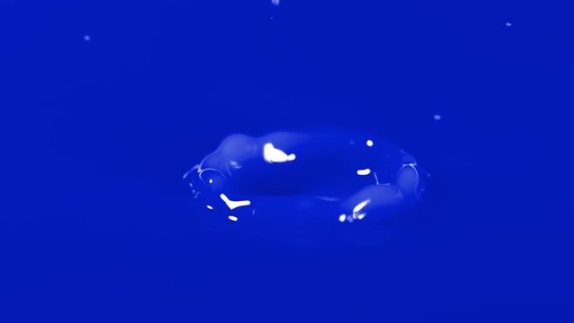 Slow motion shot of water drop falling - blue