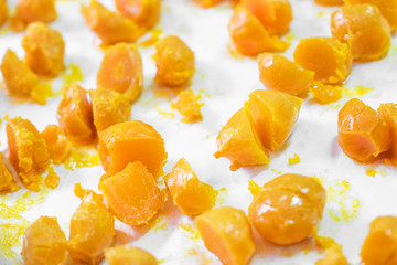 Close up of egg yolks on white background