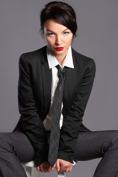  woman in formal suit and tie