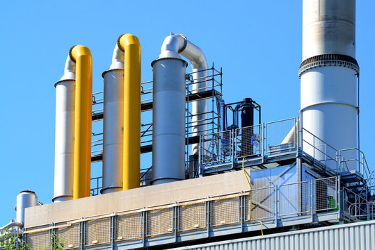 Industrial smoke filters. Scrubbers next to smokestack. 