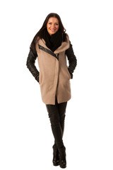 Woman in winter coat standing confidently and smiling. Business