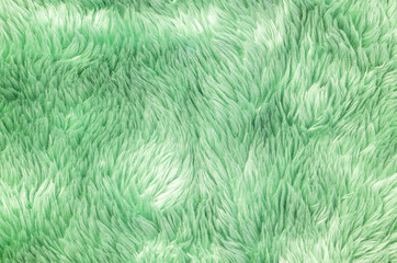 Closeup surface abstract fabric pattern at the green fabric carpet at the floor of house texture background