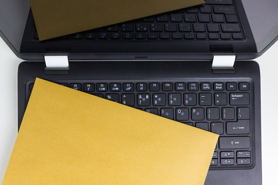 brown envelope on laptop