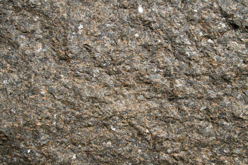 Dark granite texture with natural pattern. Background of natural stone.