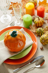 Thanksgiving dinner. Seasonal table setting with autumn leaves,