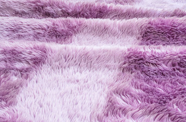 Closeup surface abstract fabric pattern at the purple fabric carpet at the floor of house texture background
