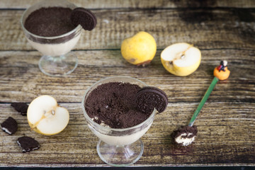 Creamy pear cheesecake with oreo cookies topping