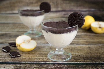 Creamy pear cheesecake with oreo cookies topping