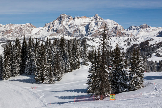 View of the Alpe di Fanes cliffs in winter, with the peaks Conturines and Piz Lavarella, Alta Badia, Italian Dolomites.