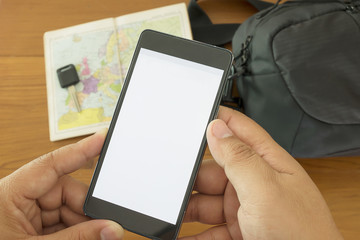 Preparing to Travel Concept, Hand Hold Mobile Phone