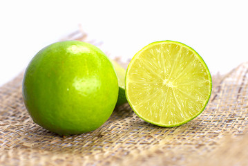 Fresh Slice Green Lemons, Isolated on White Background