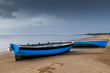 Naklejka na ściany i meble Boats at the beach on the White sea shore