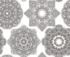 Seamless pattern with hand drawn vector oriental mandalas