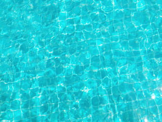 Background of Swimming Pool Water in Sunshine Day