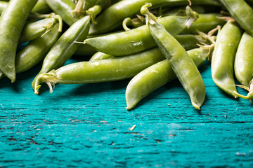 green peas on wooden table ,healthy concept