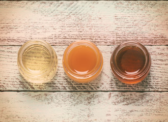 healthy honey composition, wooden background, vintage filters