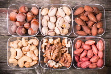 Mix nuts on wooden table,healthy vegan food.