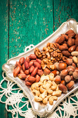 Mix nuts on wooden table,healthy vegan food.