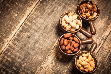 Mix nuts on wooden table,healthy vegan food.