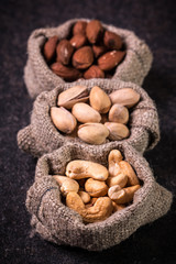 Mix nuts on wooden table,healthy vegan food.