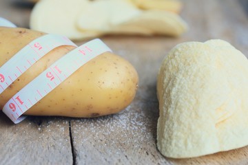 Fresh potatoes with potatoes chips