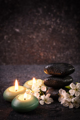 Fototapeta na wymiar spa concept with stone and candles on wooden table ,