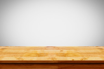 Empty top of wooden table on white background.