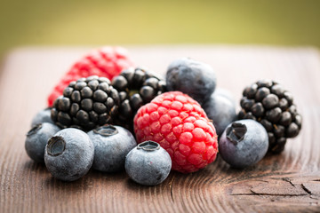 Fresh summer berries , wooden background, healthy food.
