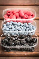 Fresh summer berries , wooden background, healthy food.
