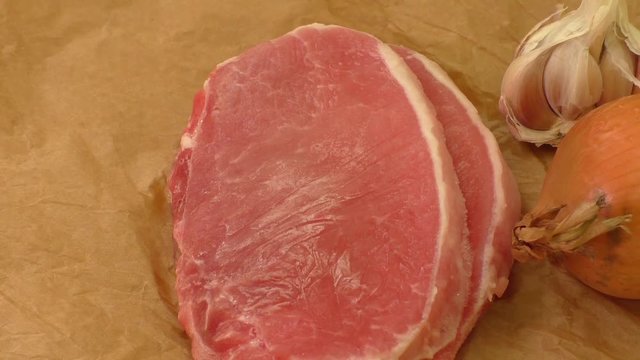 Upper view of more slices of frozen pork meet
