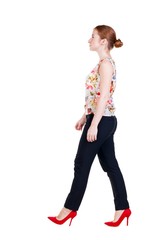 walking red head business woman. back view. going young girl in  suit. Rear view people collection.  back side view of person.  Isolated over white background.