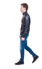 Back view of going  handsome man in jacket.  walking young guy . Rear view people collection.  backside view of person.  Isolated over white background. Sad guy in the leather jacket goes to the right