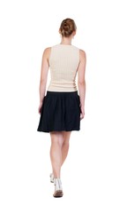 back view of walking  woman in dress. beautiful blonde girl in motion.  backside view of person.  Rear view people collection. Isolated over white background.