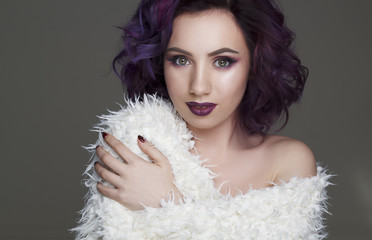 Portrait of beautiful fashion model with violet hair