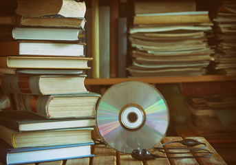 stack of books, library, cd, headphones