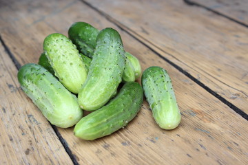 Spilling green cucumbers