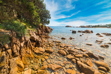 yellow rocks in a small beach in Sardinia